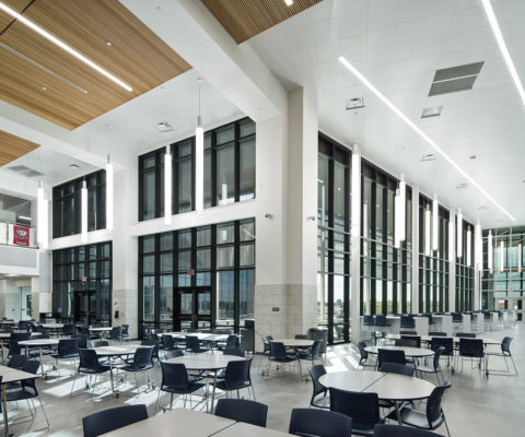 Strike Middle School cafeteria with floor-to-ceiling windows providing natural lighting